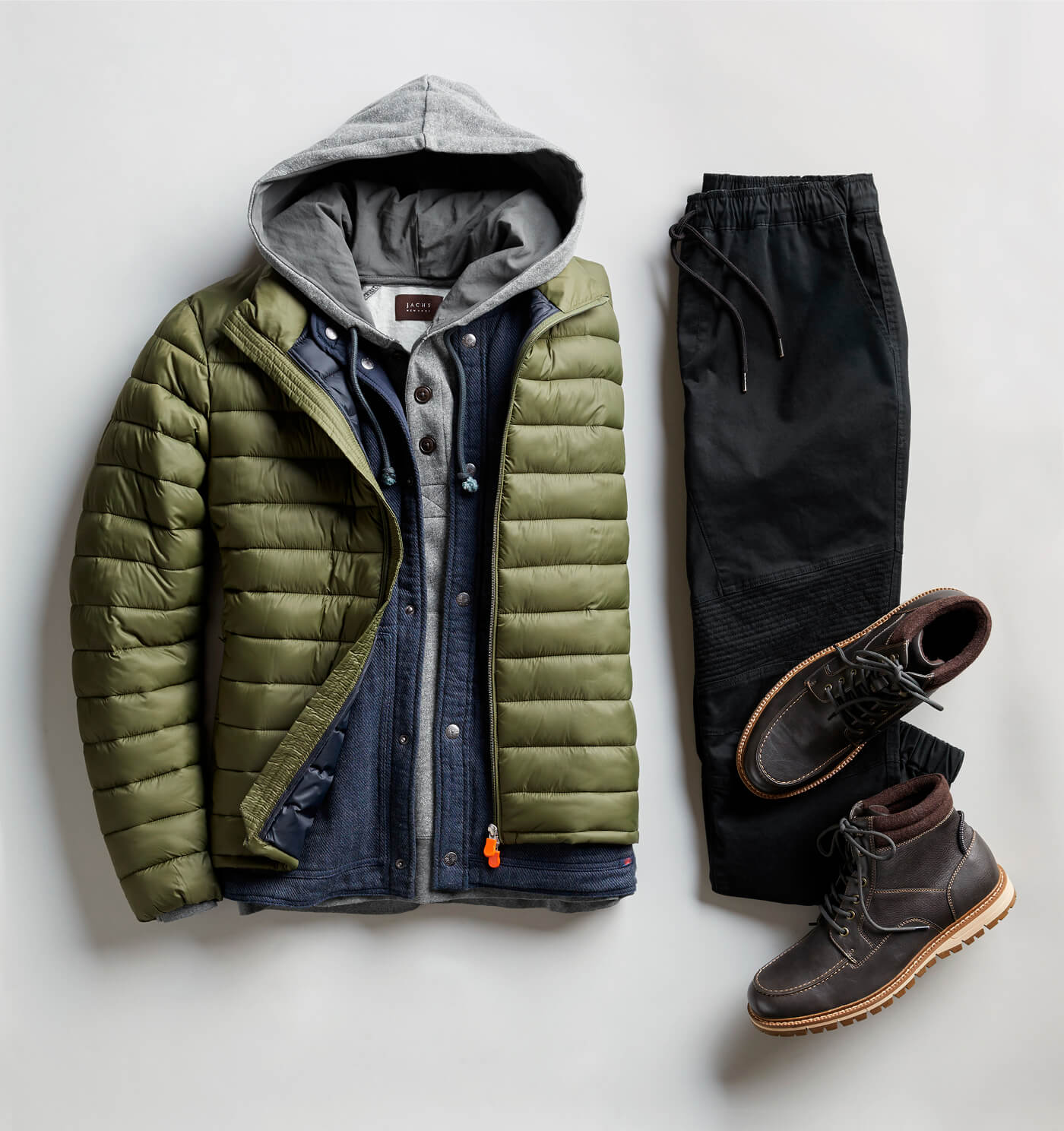 green puffer and black joggers